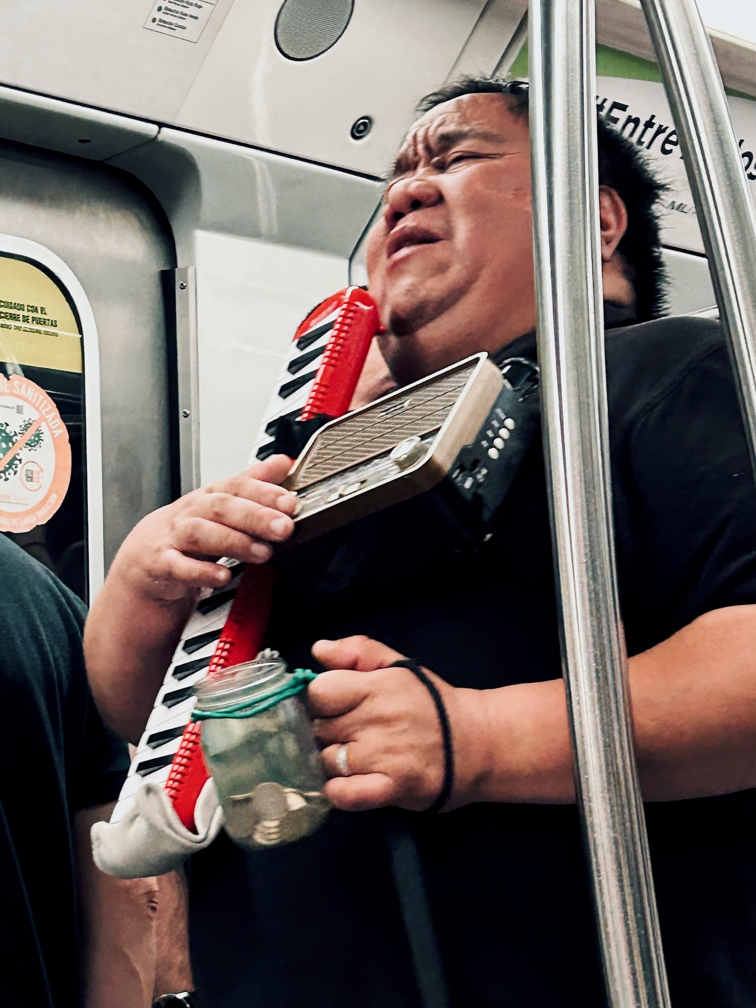 Blind musician playing melodica at Santiago subway (RNI Films app, profile ‘Kodak Ektar 100’)