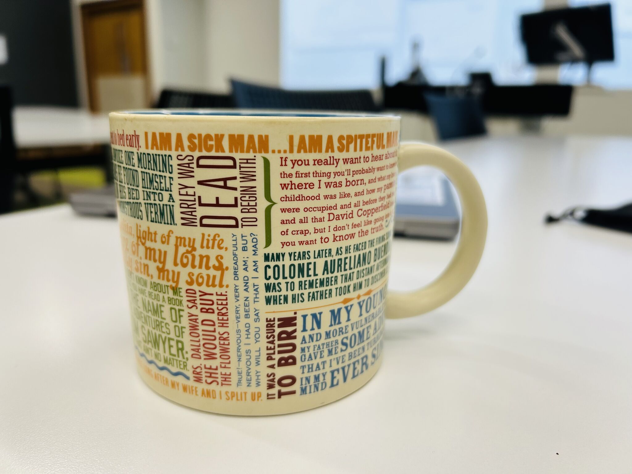 Celebratory tea cup, with my first lines of literature mug.