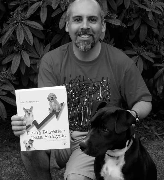 Newton the dog and Luis with our new copy of Doing Bayesian Data Analyses.