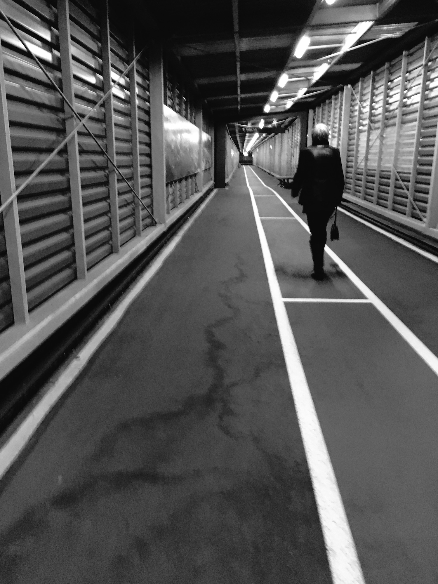 Passenger walking from airplane to regional terminal, Christchurch.