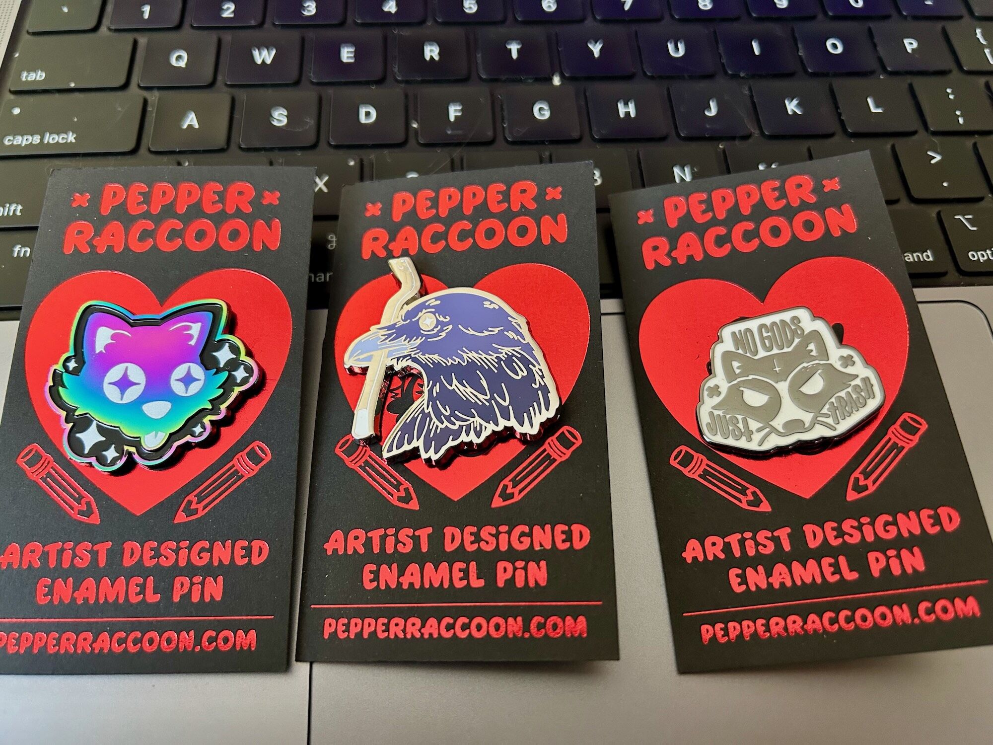 Got some new cool pins. Crow with a crowbar... genius!