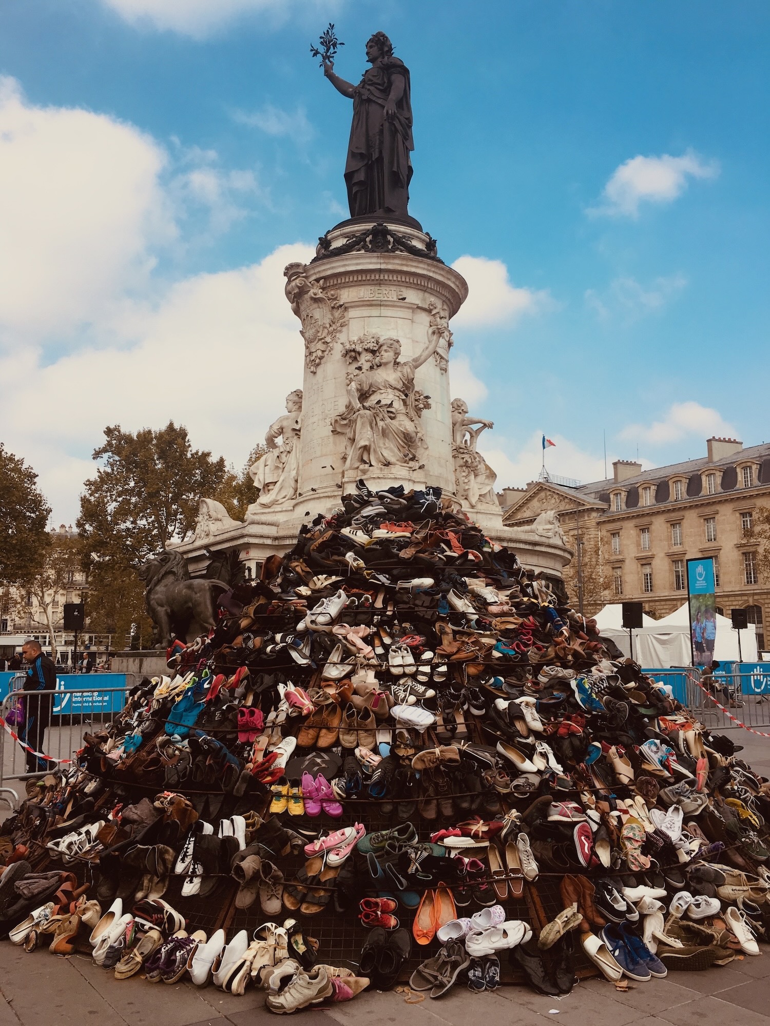 Statue base covered with shoes, Paris.