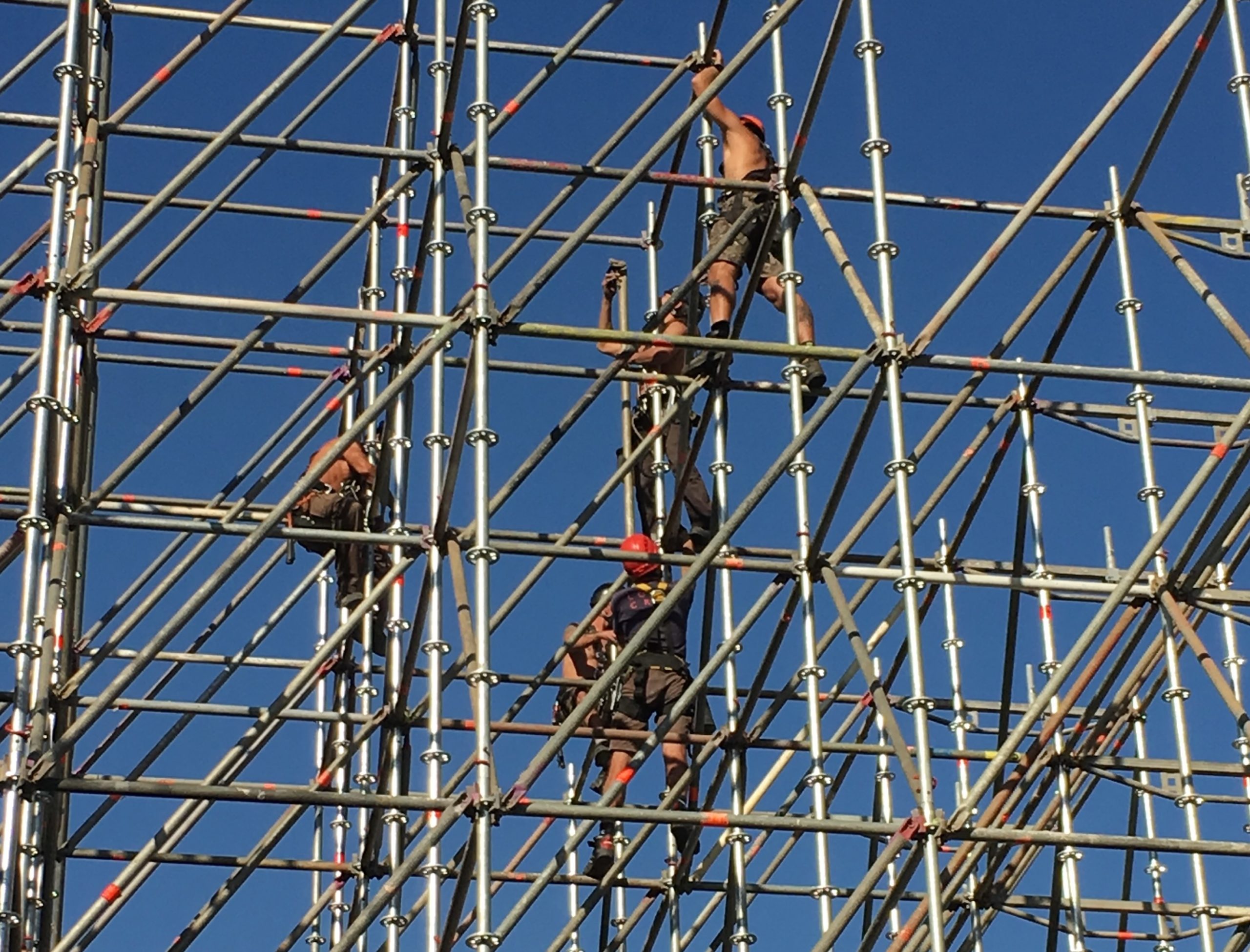 Workers on building scaffolding.